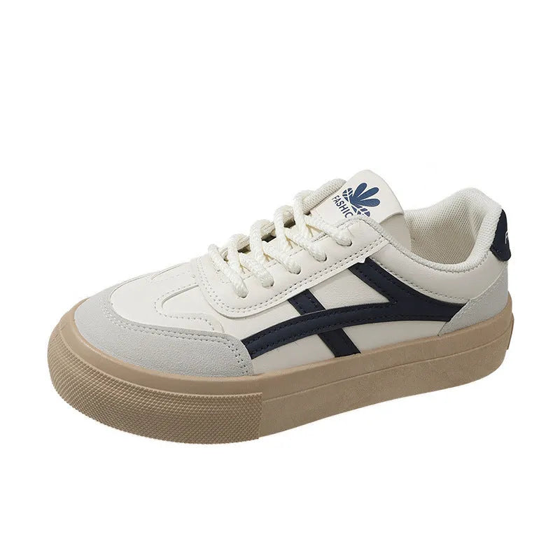 Low-top blue and brown casual lace-up shoes with round toe and flat rubber sole.
