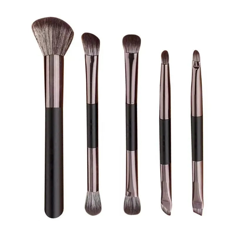 Portable makeup brush set with mirror showing artificial fibre brushes with silver handles