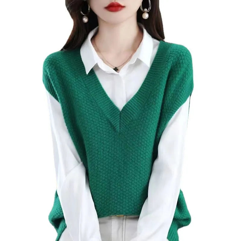 Women's creamy-white V-neck sleeveless vest with a raised 3D knit pattern texture, laid flat.