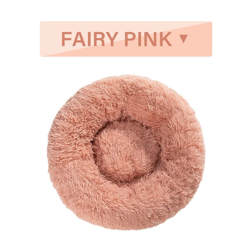 Fluffy donut-shaped pet bed with raised bolster edge in long plush material