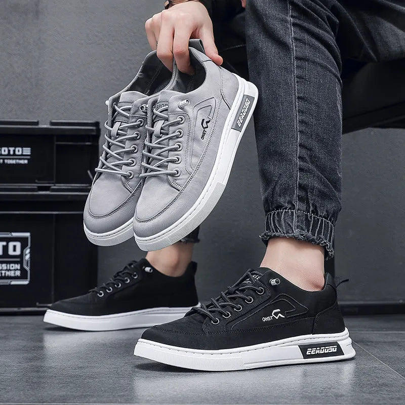 Gray men's canvas casual shoes with ice silk construction, leather lining, and rubber sole in low top design