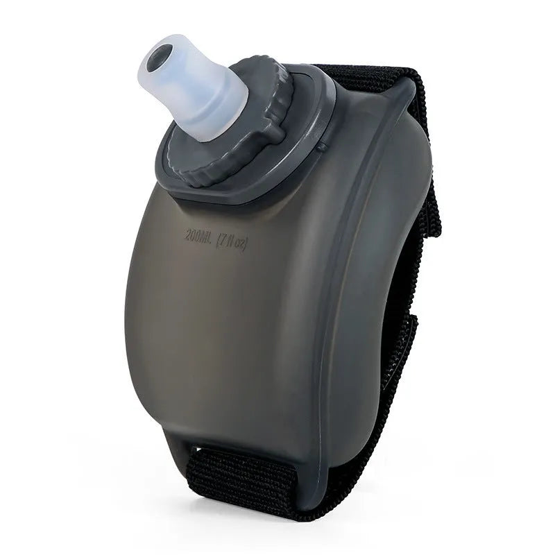 Orange wrist water bottle with Velcro strap showing 200ml capacity and silicone mouthpiece