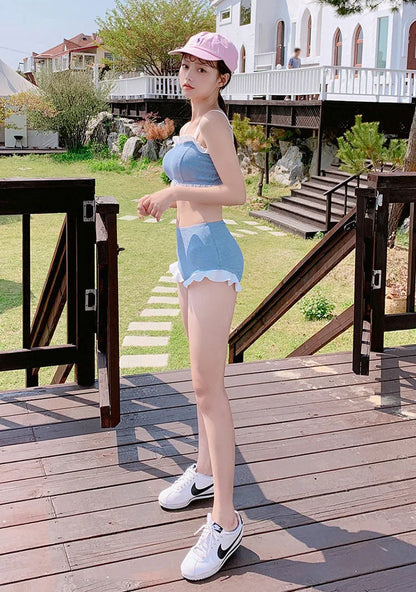 Women's solid colour conservative one-piece swimsuit with top and pants in nylon fabric