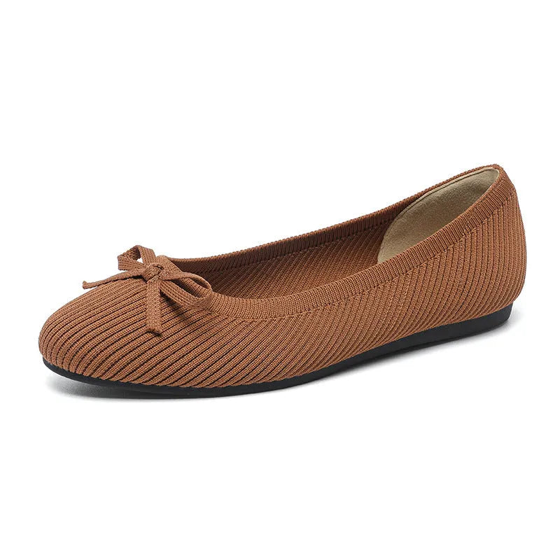Women's round toe flat pumps with bow detail in butterfly colours showing fabric upper and shallow mouth opening