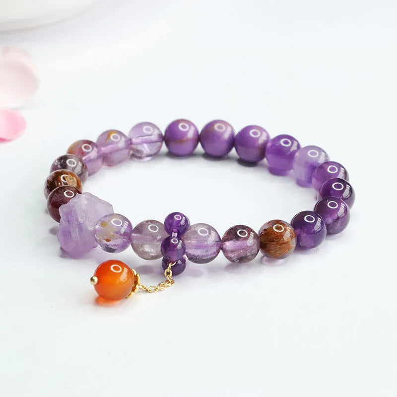 Nine purple crystal bracelet with Amethyst beads and red agate stones in Mori style design