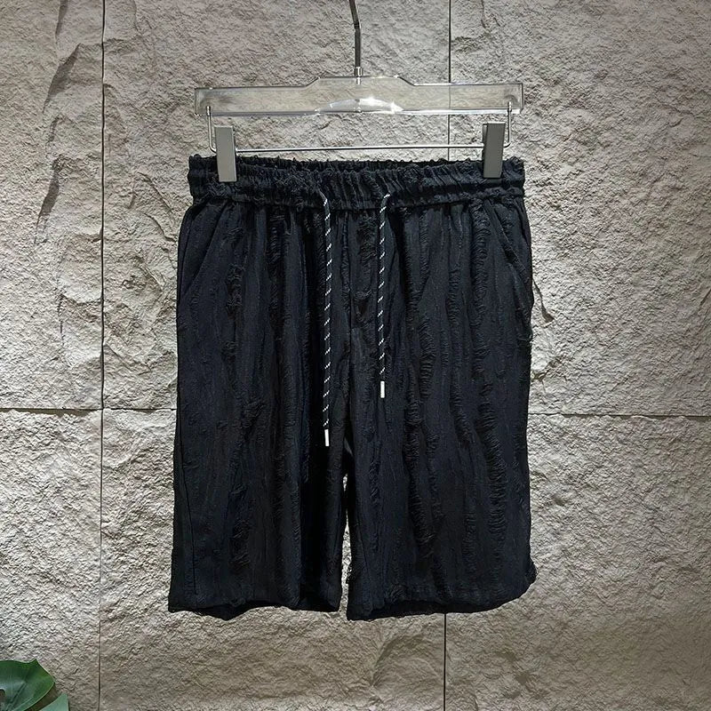 Men's black casual vest suit set with sleeveless top and mid-length trousers on a hanger