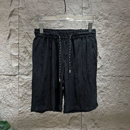 Men's black casual vest suit set with sleeveless top and mid-length trousers on a hanger