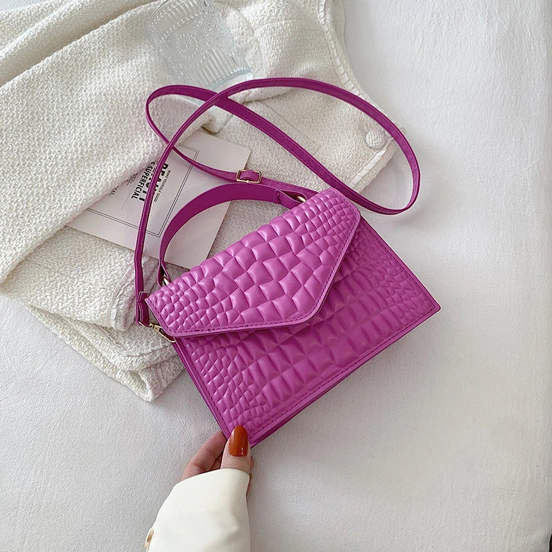 Clamshell handbag with crocodile pattern and soft handle in various colours