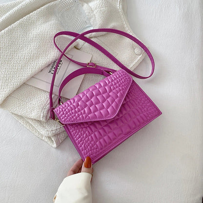 Clamshell handbag with crocodile pattern and soft handle in various colours