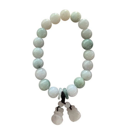 Natural green jade charm bracelet with carved apple and geometric stone pendants.