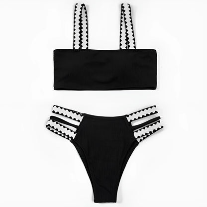 Black women's hollowed-out split swimsuit bikini set on a model.