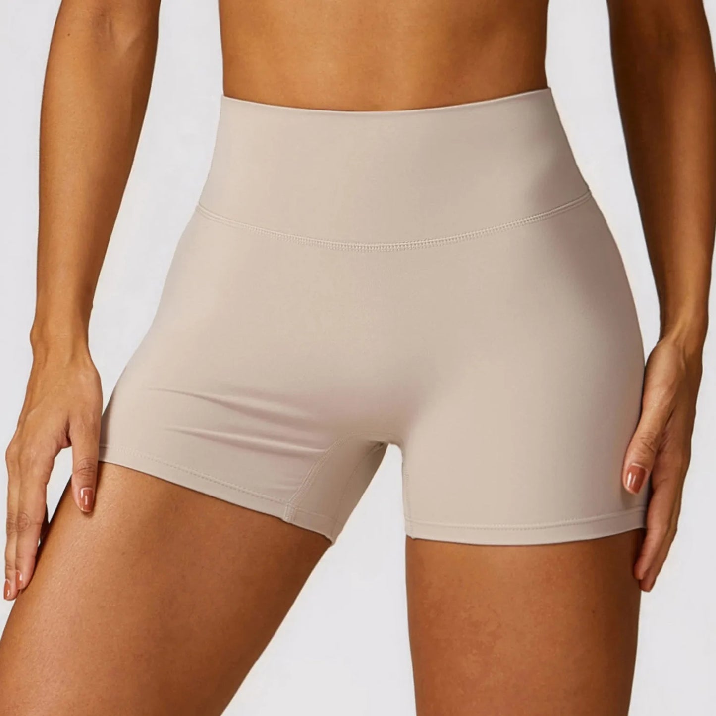 Women's high waist yoga shorts in nylon fabric with belly contracting design and hip lifting cut