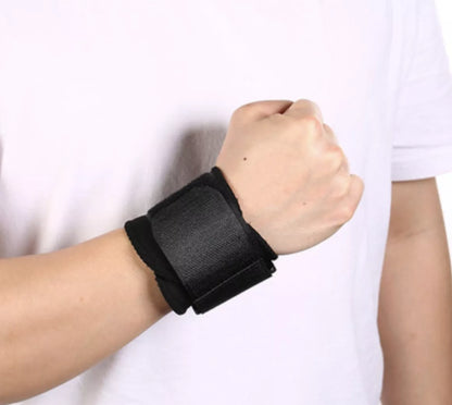 Black wrap-around wrist compression strap for sports support