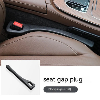Polyurethane car seat gap filler strip in assorted colours on a car seat.