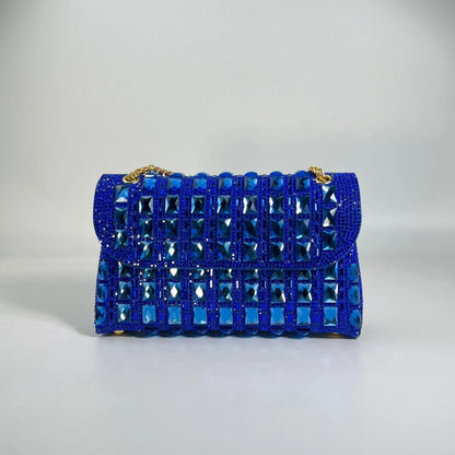 Silver rhinestone-decorated PU leather clutch bag with a metal chain strap, shown open to reveal interior phone pocket.