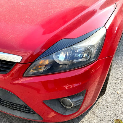 Ford Focus headlight eyebrow stickers in ABS plastic with carbon fibre pattern or piano black finish