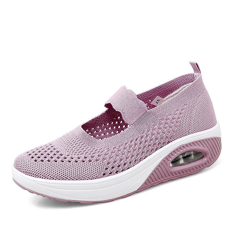 Women's black mesh slip-on casual shoes with round toe and low heel on white background