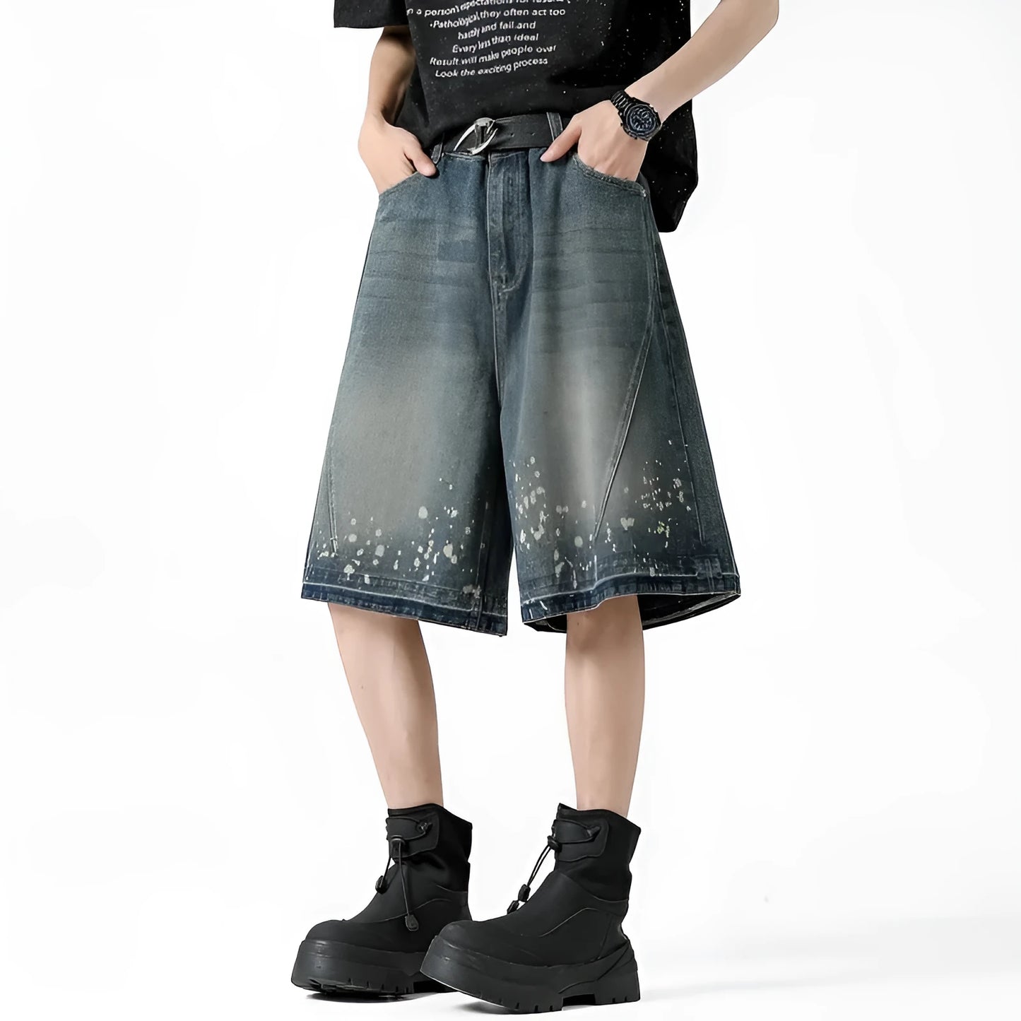 Men's retro blue denim shorts with ripped knees and splash ink detailing, straight leg mid-thigh cut.