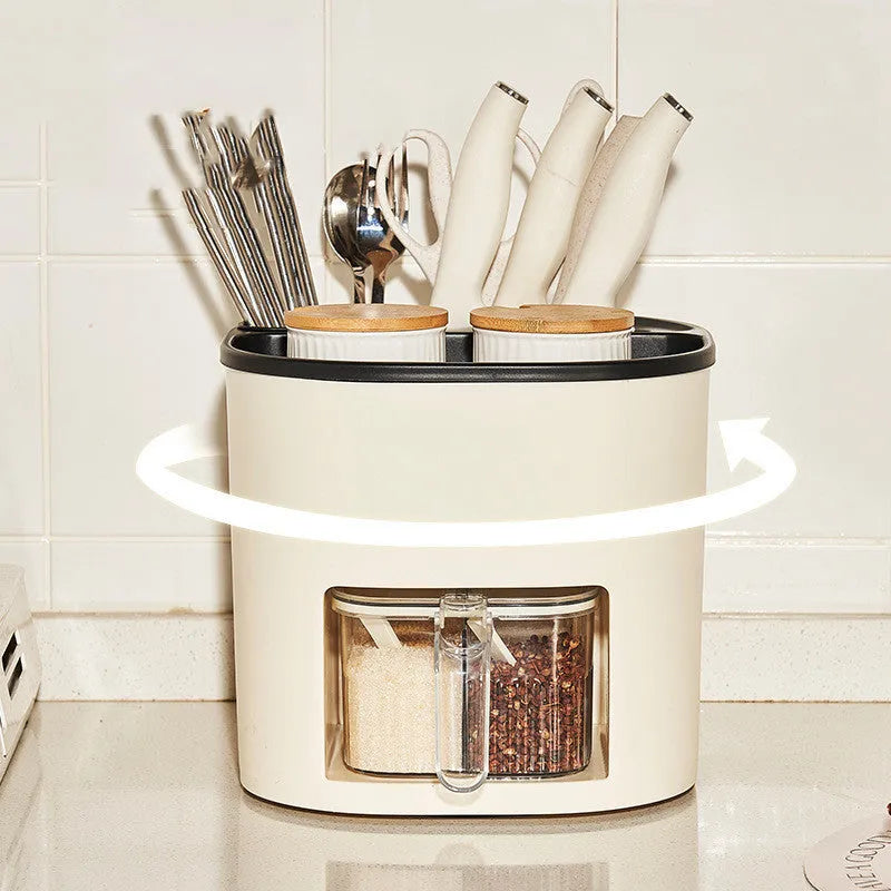 White rotating plastic kitchen storage bucket and a separate white spice box with four compartments on a countertop.
