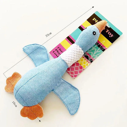 Blue duck-shaped dog plush toy with two squeakers for dental cleaning, 33 cm by 10 cm