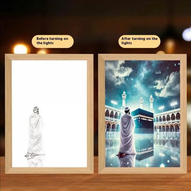 Modern rectangular light painting photo frame displaying an illuminated cross and scenic artwork.