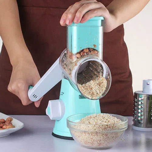 Blue multifunctional round mandoline vegetable slicer and cheese grater with stainless steel blades on a kitchen counter.