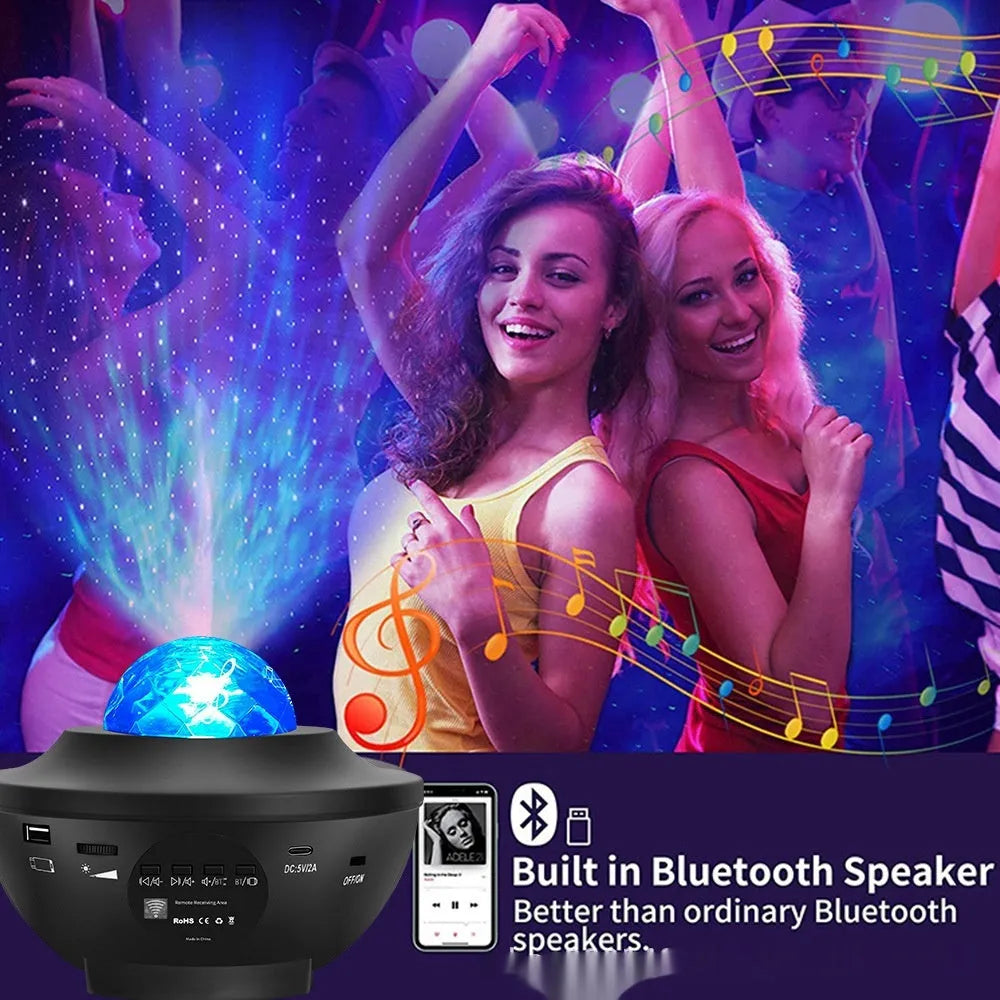Small black bowl-shaped starry sky projection lamp with remote control on a desk.