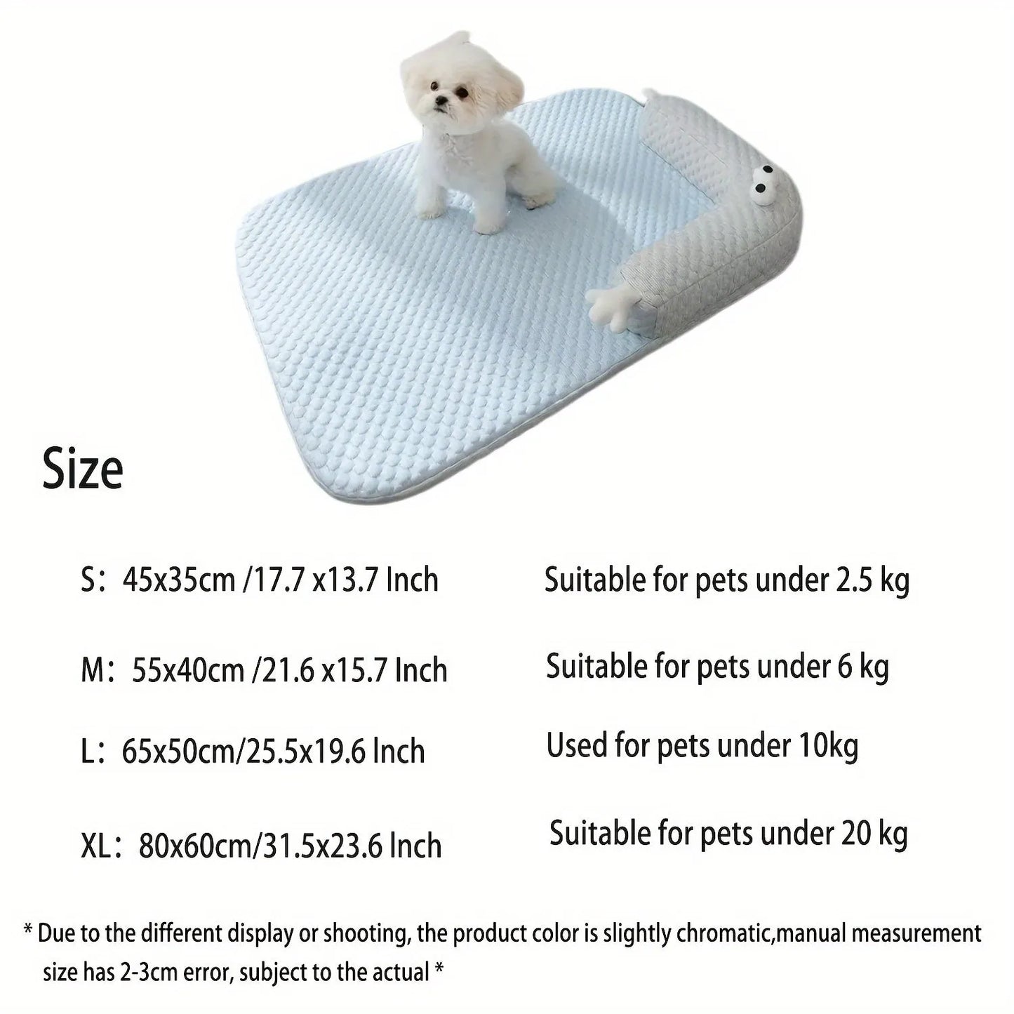Blue pet bed cushion with big-eyed monster design, shown on a wooden floor.