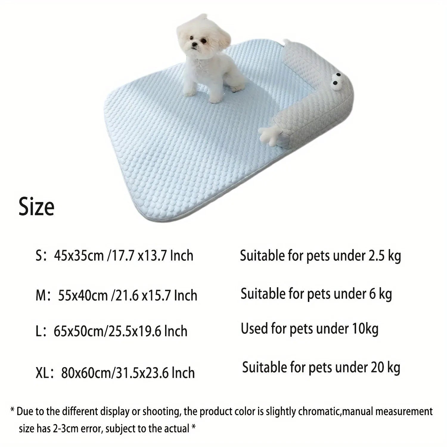 Blue pet bed cushion with big-eyed monster design, shown on a wooden floor.