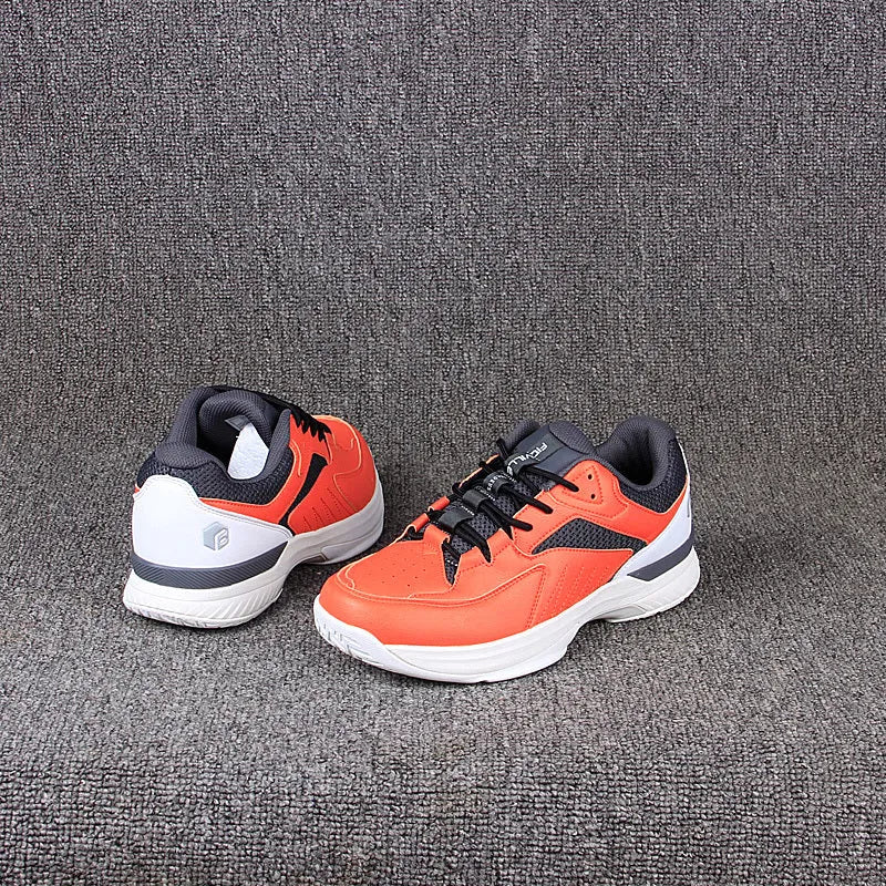 Orange men's wide fit tennis shoes with suede and mesh upper, lace-up closure, and rubber outsole.