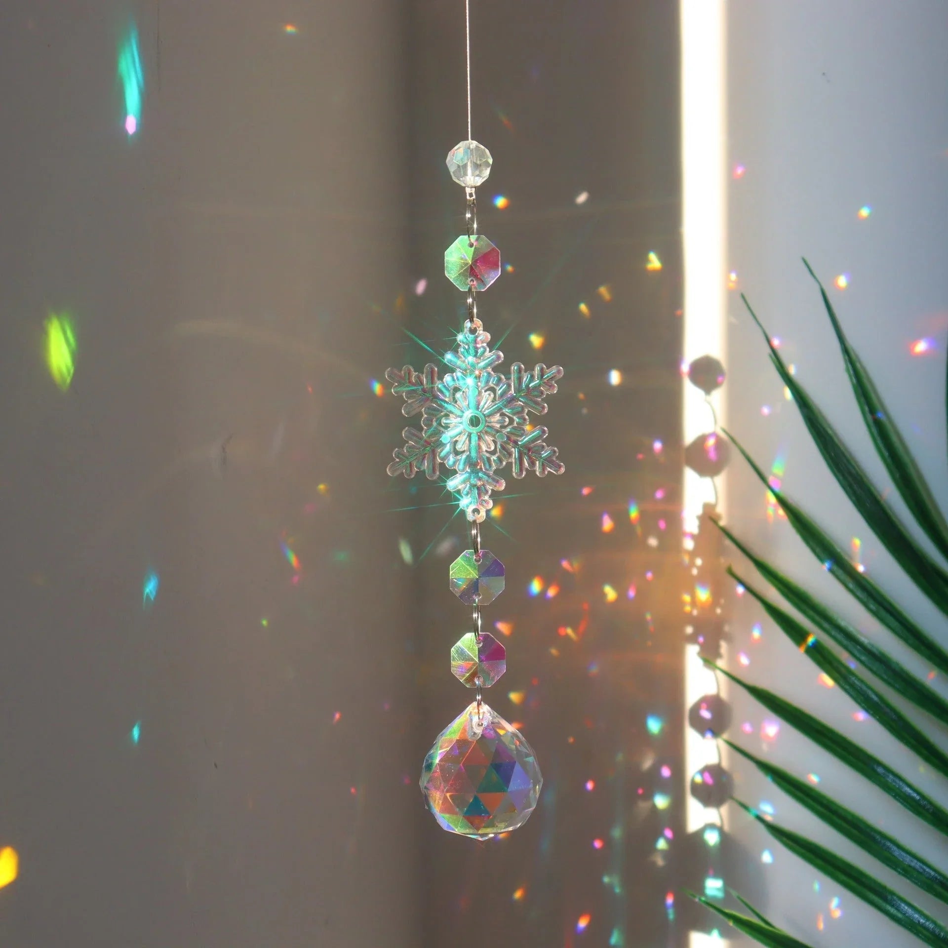 Snowflake Crystal Sun Catcher with intricate design and iridescent AB color finish, creates a mesmerizing kaleidoscope of colors
