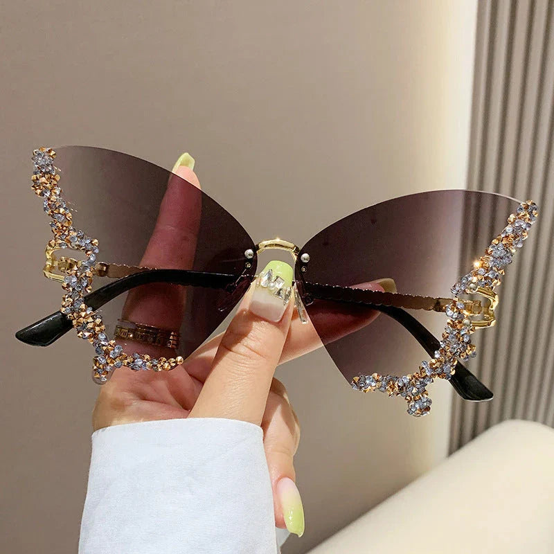 Chic butterfly-shaped sunglasses with diamond accents in various gradient color options