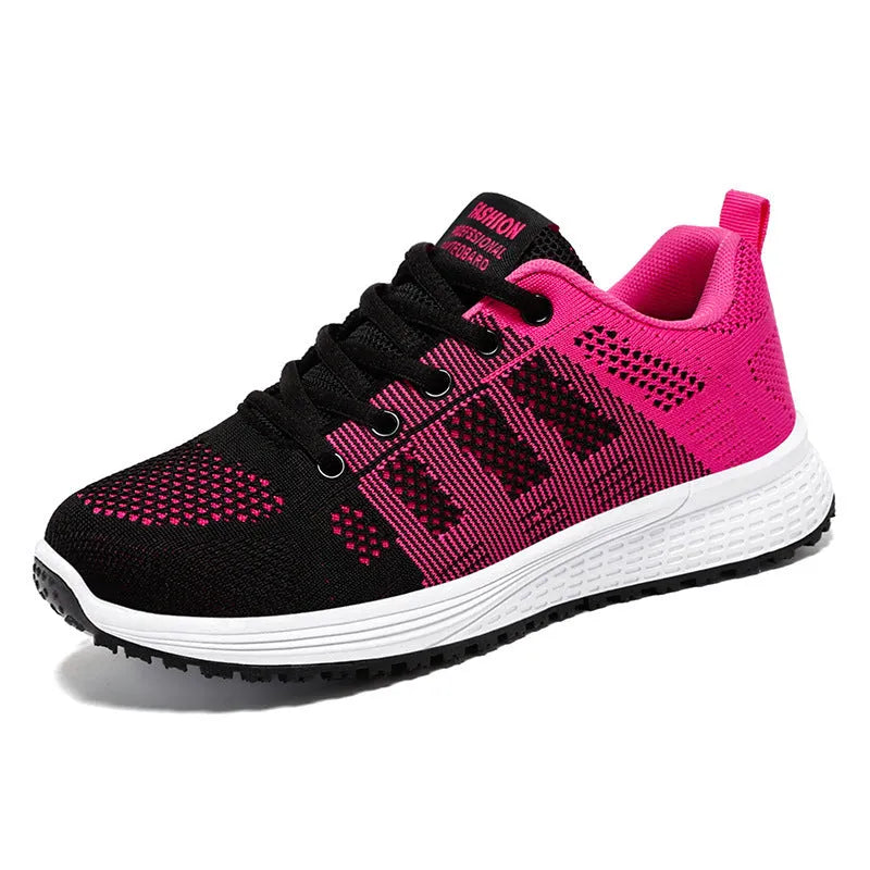 Women's flyknit running shoes in grey pink with soft sole and lace-up front.