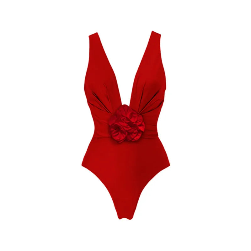 Red women's V-neck halter swimsuit with open back and a matching detachable long skirt laid flat.
