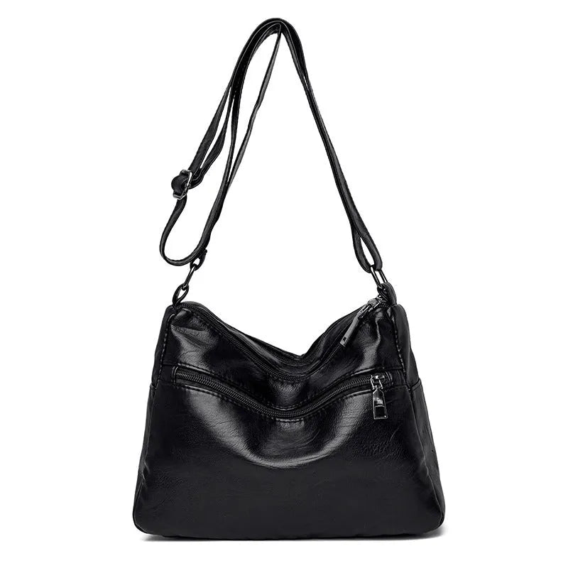 Middle-aged women's double layer PU shoulder bag with large capacity, welt pocket, and soft build in red, purple, dark blue, black, bronze, gray, or tan.