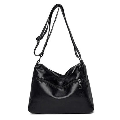 Middle-aged women's double layer PU shoulder bag with large capacity, welt pocket, and soft build in red, purple, dark blue, black, bronze, gray, or tan.