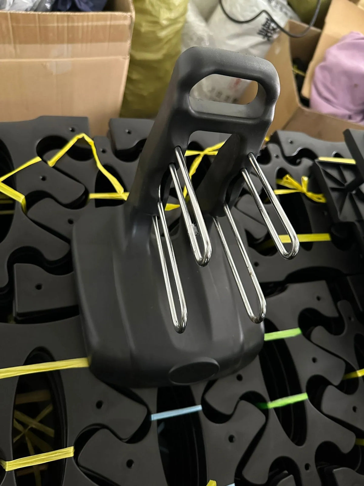PVC fitness dumbbell rack with removable bracket support on a gym floor