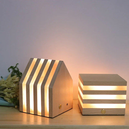 A warm, Scandinavian-inspired wooden LED night light in the shape of a heart or small house, providing cozy illumination for any room
