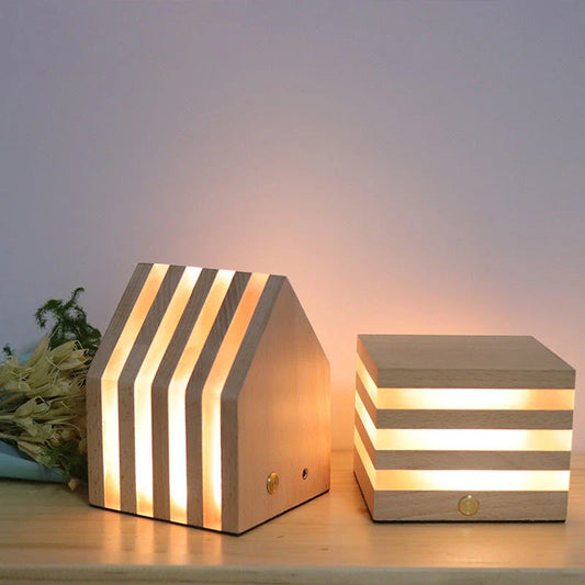 A warm, Scandinavian-inspired wooden LED night light in the shape of a heart or small house, providing cozy illumination for any room