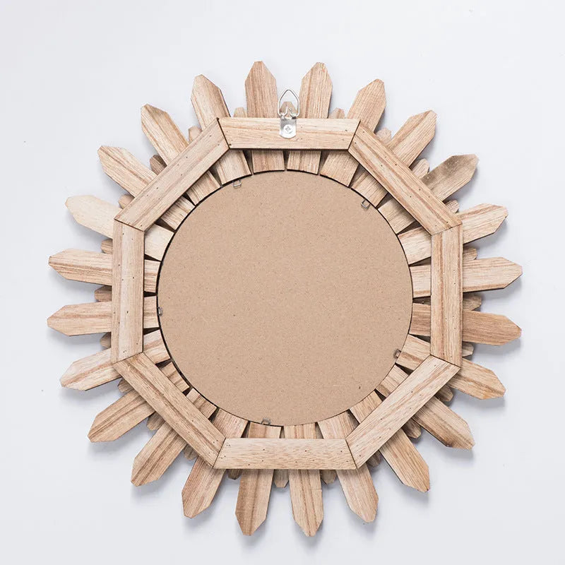 Round European-style solid wood hanging mirror with baked colour frame on a wall.