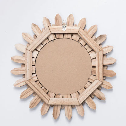 Round European-style solid wood hanging mirror with baked colour frame on a wall.