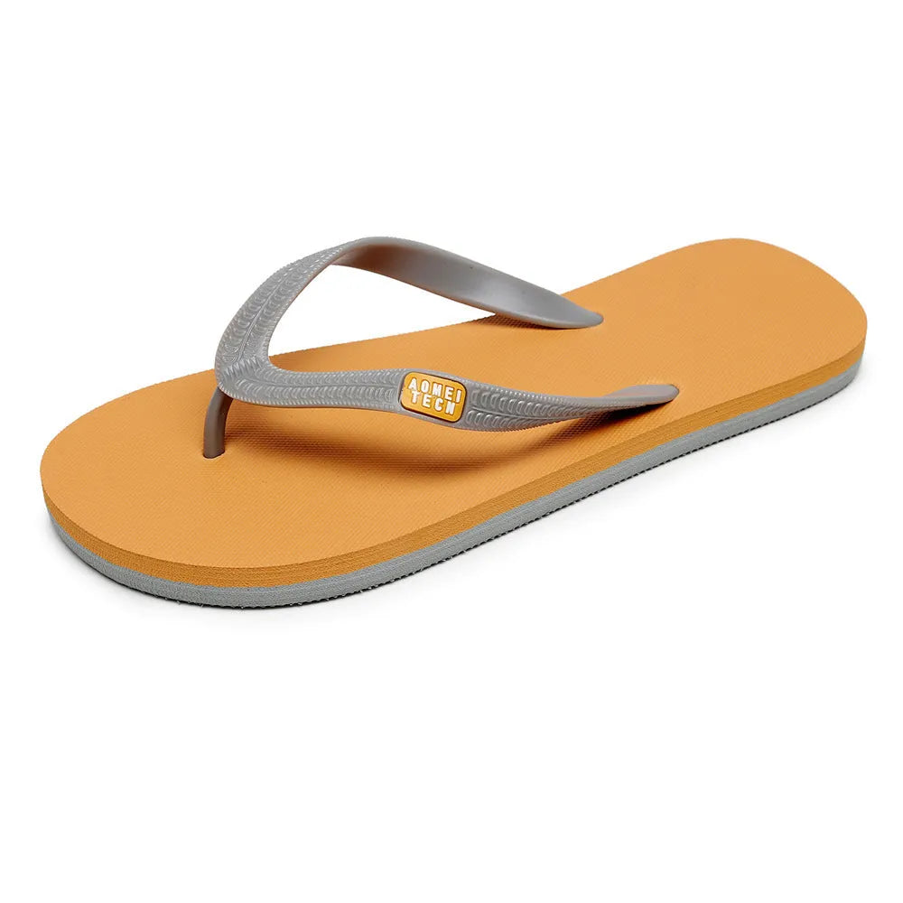 Men's black flip-flop slippers with EVA upper and textured rubber sole on a sandy background.