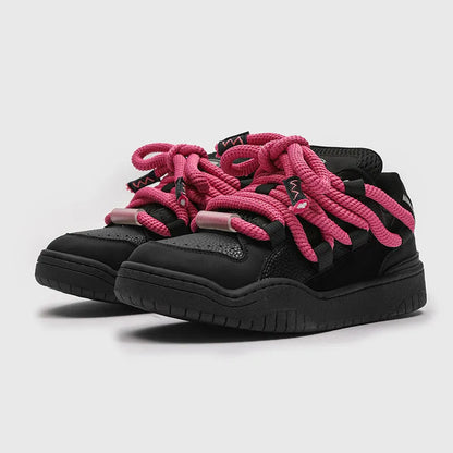 Low-top unisex casual shoes in denim blue with a round toe, thick rubber sole, and front lace-up closure.