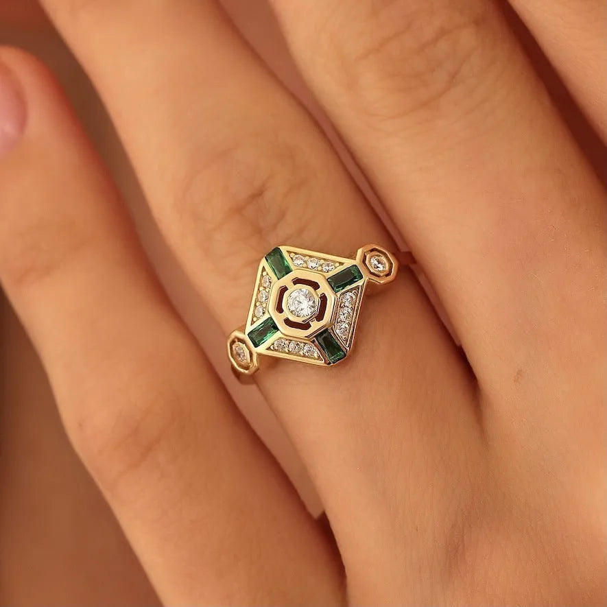 Square geometric gemstone ring with electroplated finish in lvzuan colour, shown on a model's hand.