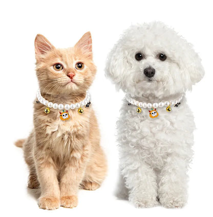 Three pearl necklaces with bells for pet Halloween costumes and decoration