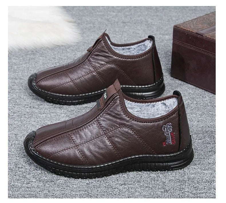Men's brown casual winter boots with a round toe, buckle closure, and a low-top cotton upper.