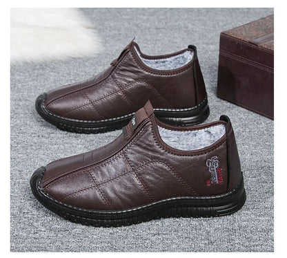 Men's brown casual winter boots with a round toe, buckle closure, and a low-top cotton upper.
