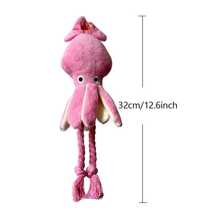 Pink squid-shaped corduroy plush dog toy with a squeaker.