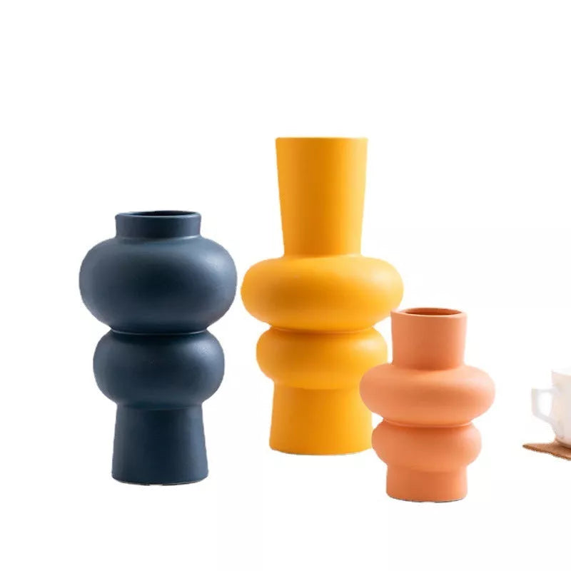 Nordic minimalist ceramic vase with glazed finish in blue, yellow, and orange options