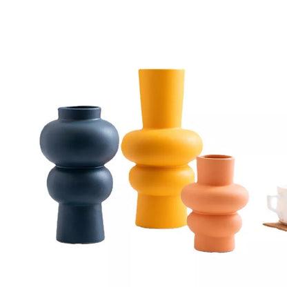 Nordic minimalist ceramic vase with glazed finish in blue, yellow, and orange options